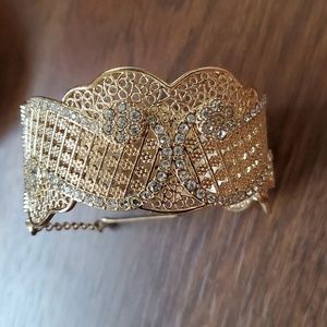 Gold cuff bracelet with rhinestones